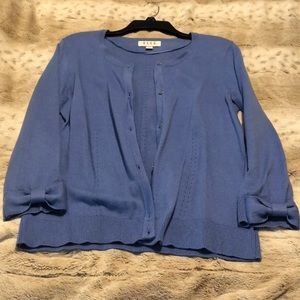Blue sweater with bow detailing on sleeves